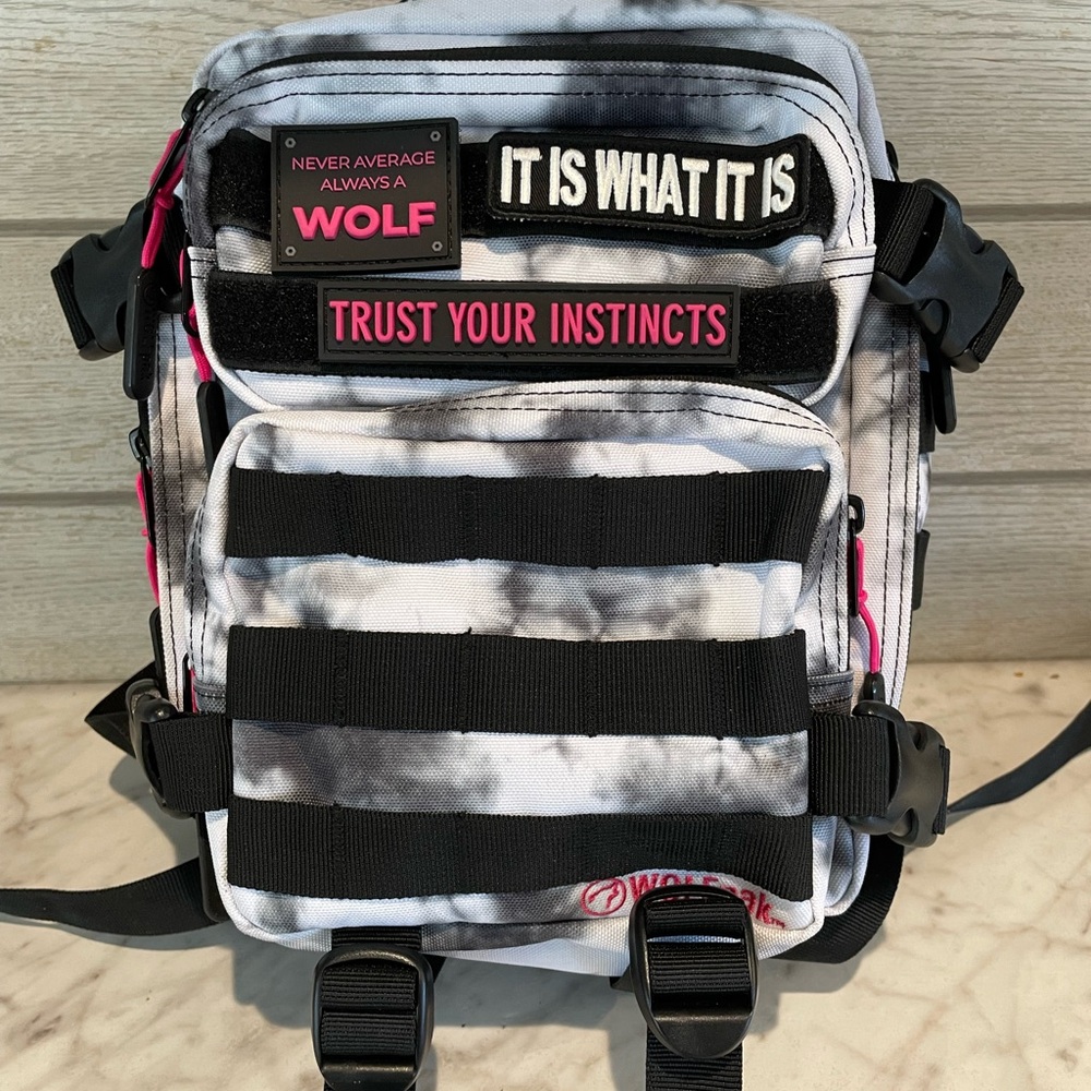 Wolfpak 9L mini bag. Hot pink, black and white. New.